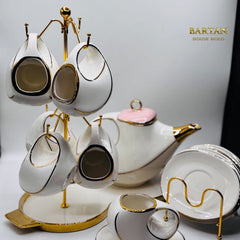 White ceramic tea set with gold accents on a stand, featuring the brand 'BANTAN'.